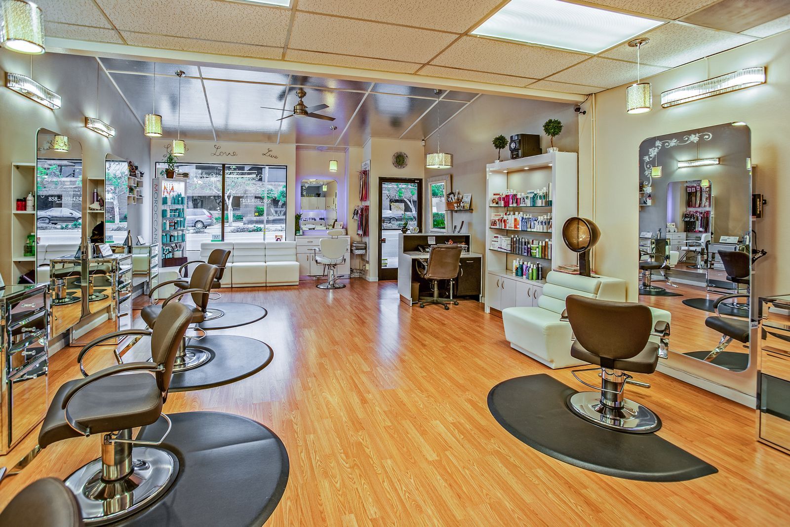 Salon interior with warm lighting and styled seating